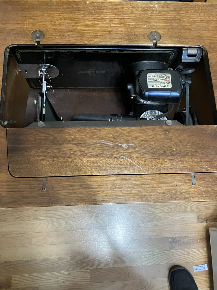 Machine lowered into cabinet